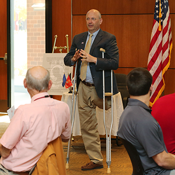 Greg Musil, Chair of the 赌钱app可以微信提现 Board of Trustees addresses veteran employees